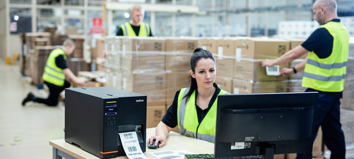 workers labelling goods with tJ printer