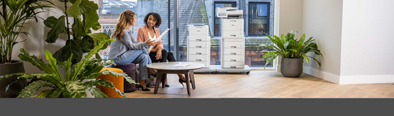 Team of people looking at printouts